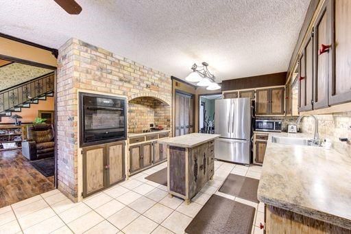 Interior, Kitchen, Living room, Stainless Steel Appliances, Stone Walls, Wood Texture Flooring