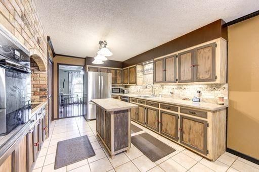 Interior, Kitchen, Stainless Steel Appliances, Stone Walls