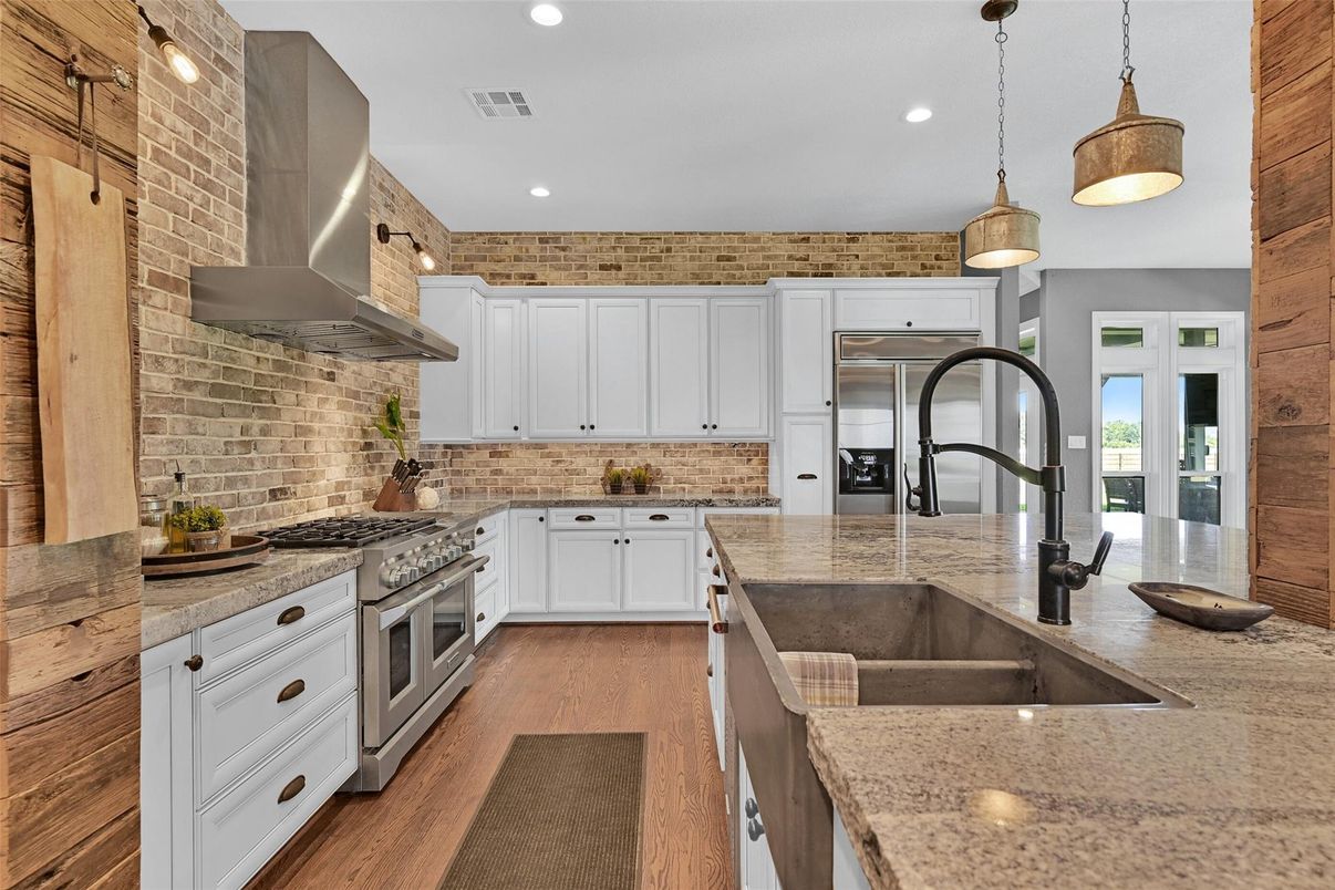 Interior, Kitchen, Pendant Lights, Recessed Lighting, Stainless Steel Appliances, Stone Walls, Wood Texture Flooring