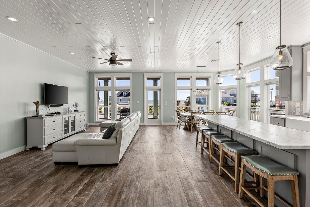 Dining room, Fireplace, Interior, Living room, Pendant Lights, Recessed Lighting, Wood Texture Flooring