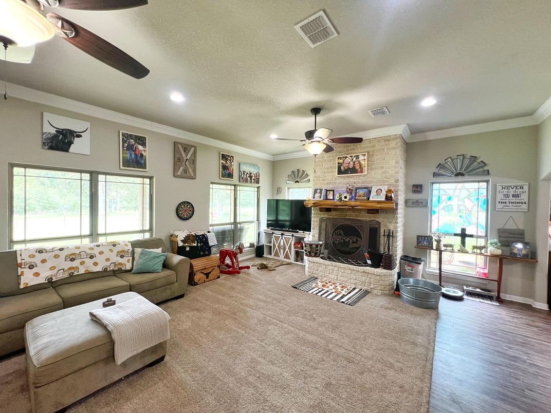 Fireplace, Interior, Living room, Recessed Lighting, Stone Walls, Wood Texture Flooring