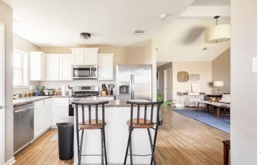 Dining room, Interior, Kitchen, Living room, Pendant Lights, Stainless Steel Appliances, Wood Texture Flooring