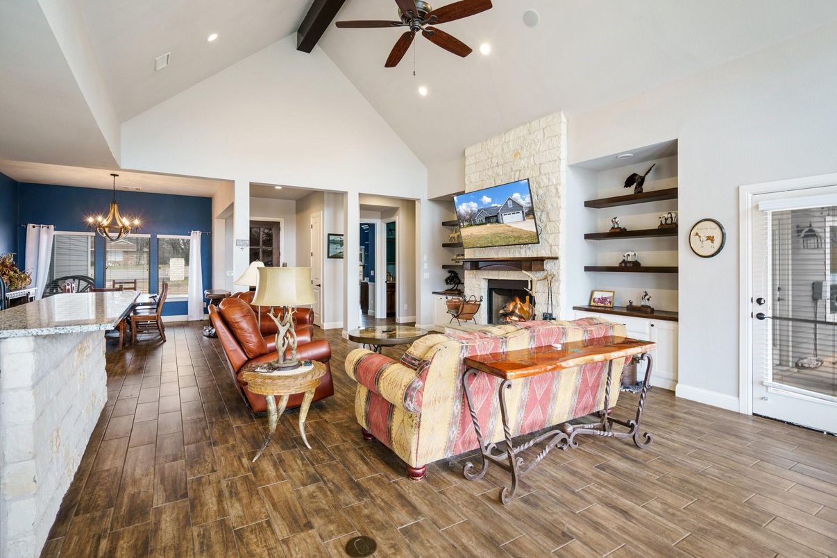 Chandelier, Dining room, Fireplace, Interior, Living room, Recessed Lighting, Stone Walls, Wood Texture Flooring