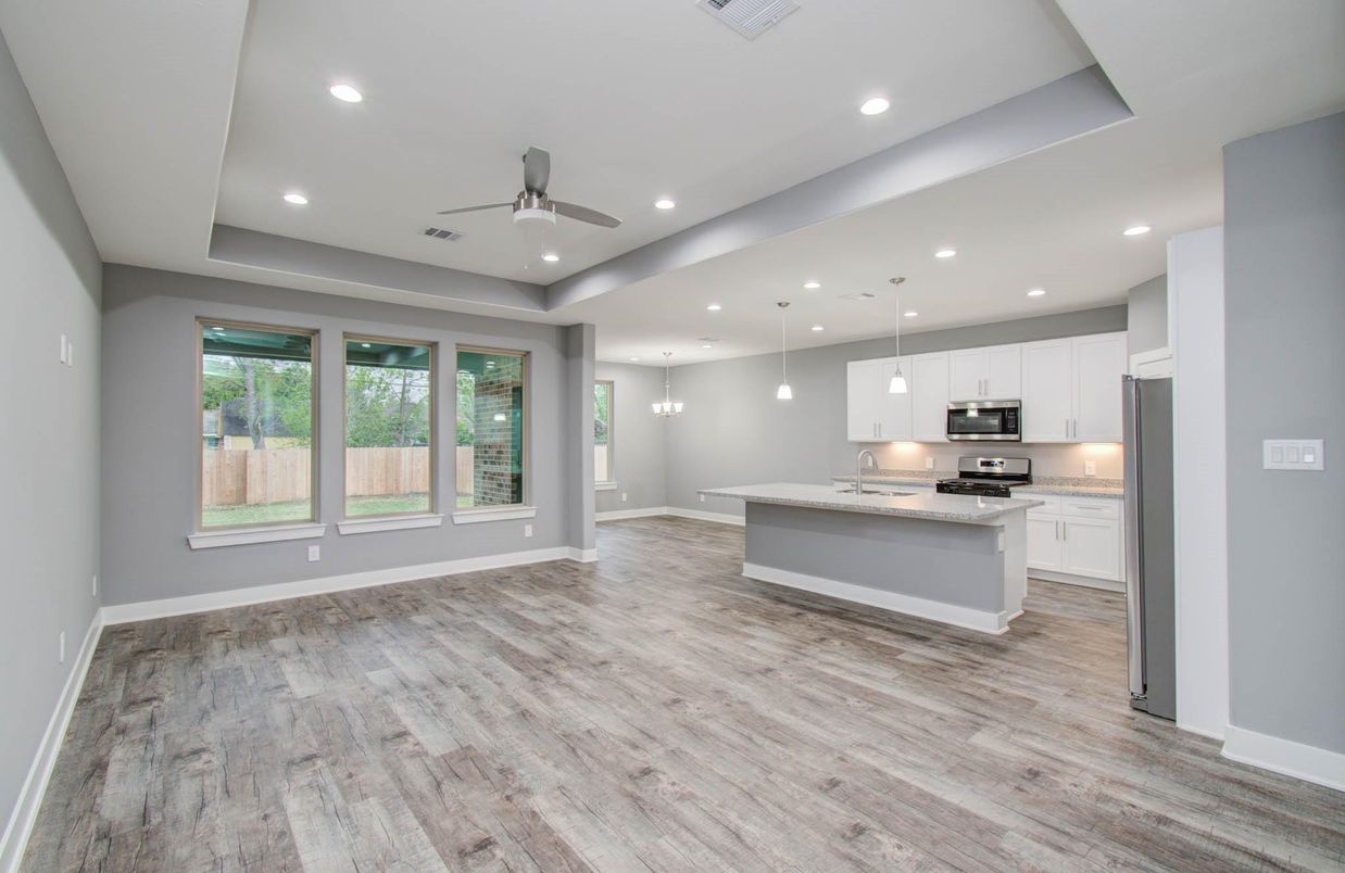 Empty room, Interior, Kitchen, Pendant Lights, Recessed Lighting, Stainless Steel Appliances, Wood Texture Flooring