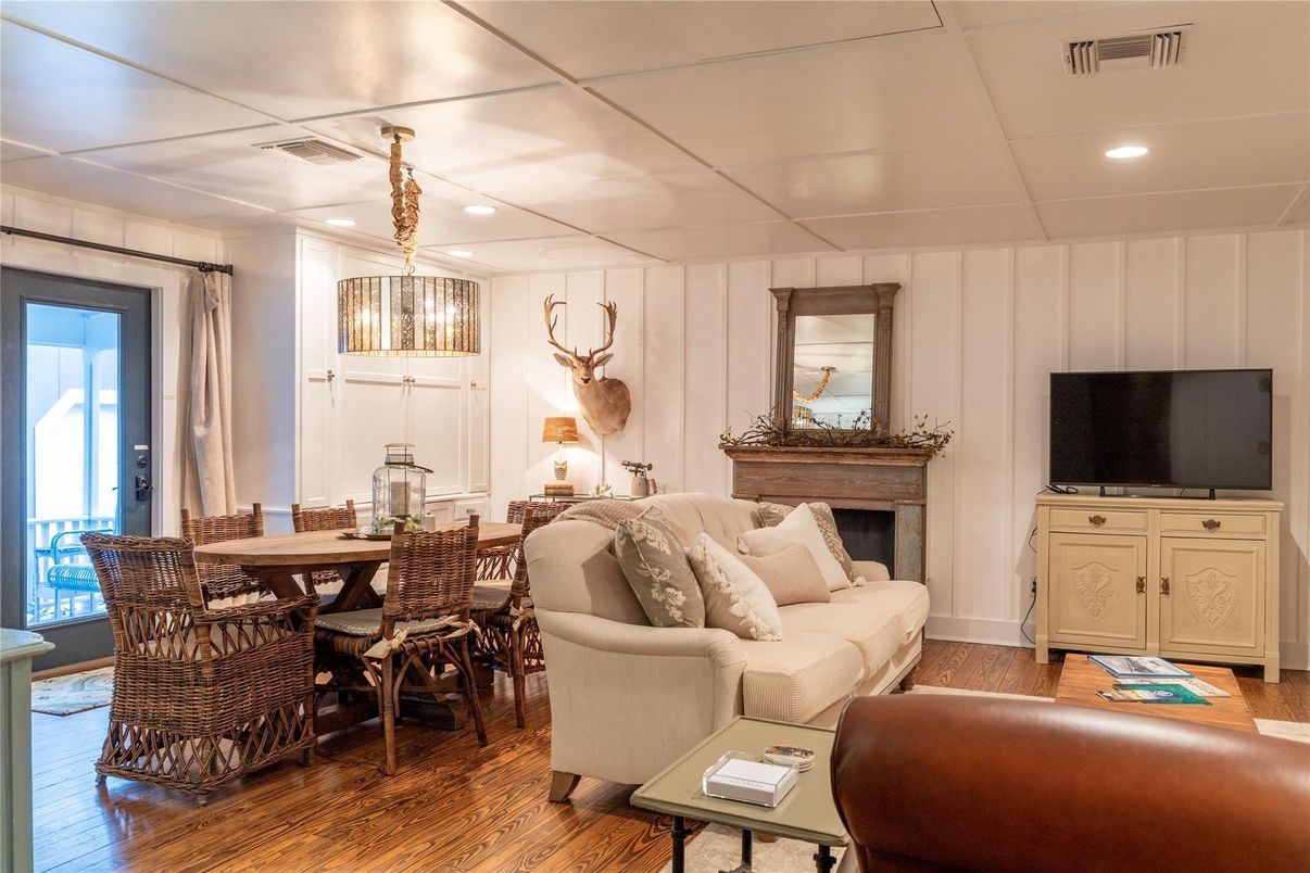 Dining room, Fireplace, Interior, Living room, Pendant Lights, Recessed Lighting, Wood Texture Flooring