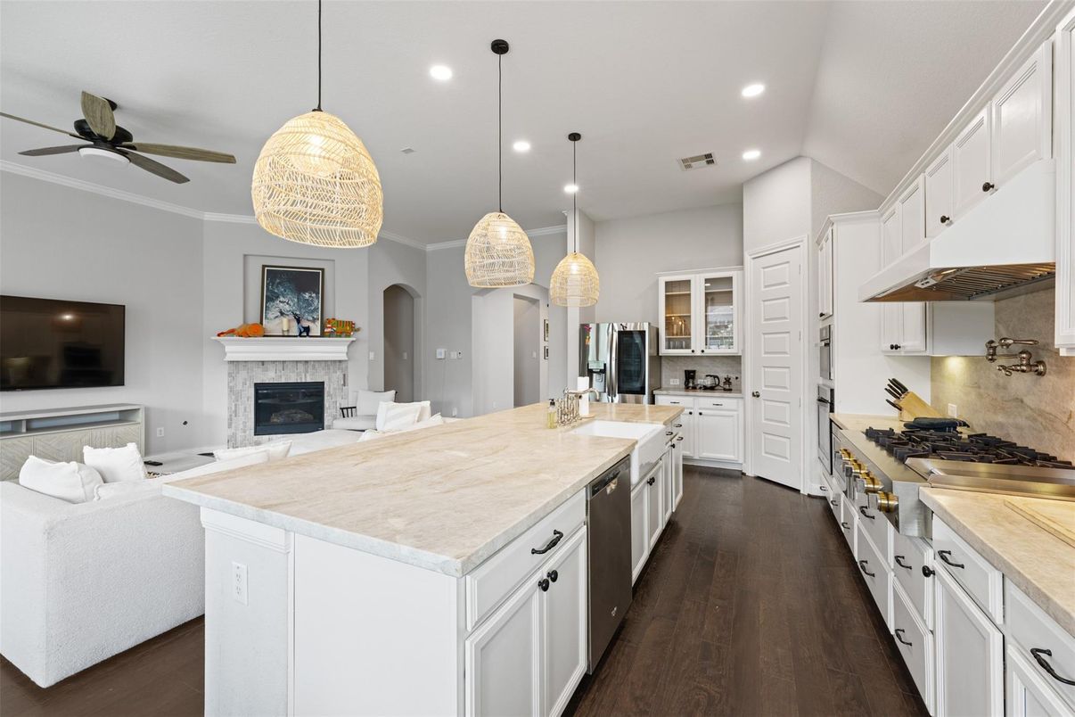 Fireplace, Interior, Kitchen, Living room, Pendant Lights, Recessed Lighting, Stainless Steel Appliances, Wood Texture Flooring