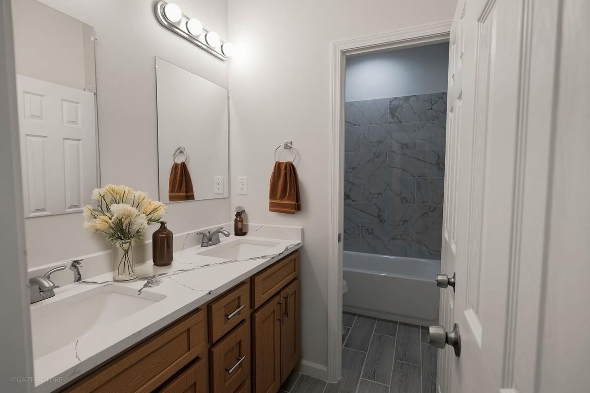 Bathroom, Dual Sink Vanities, Interior, Marble Walls, Wood Texture Flooring
