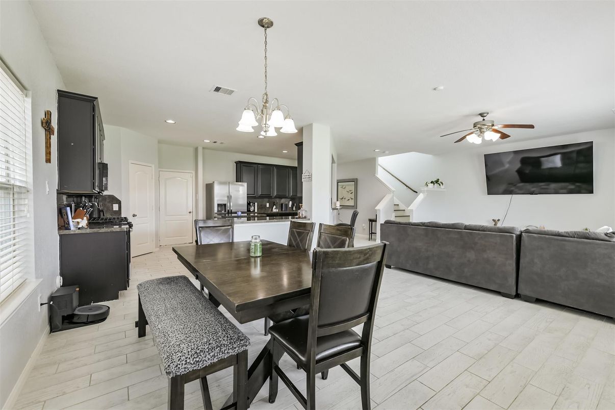 Chandelier, Dining room, Interior, Kitchen, Living room, Pendant Lights, Recessed Lighting, Stainless Steel Appliances, Wood Texture Flooring
