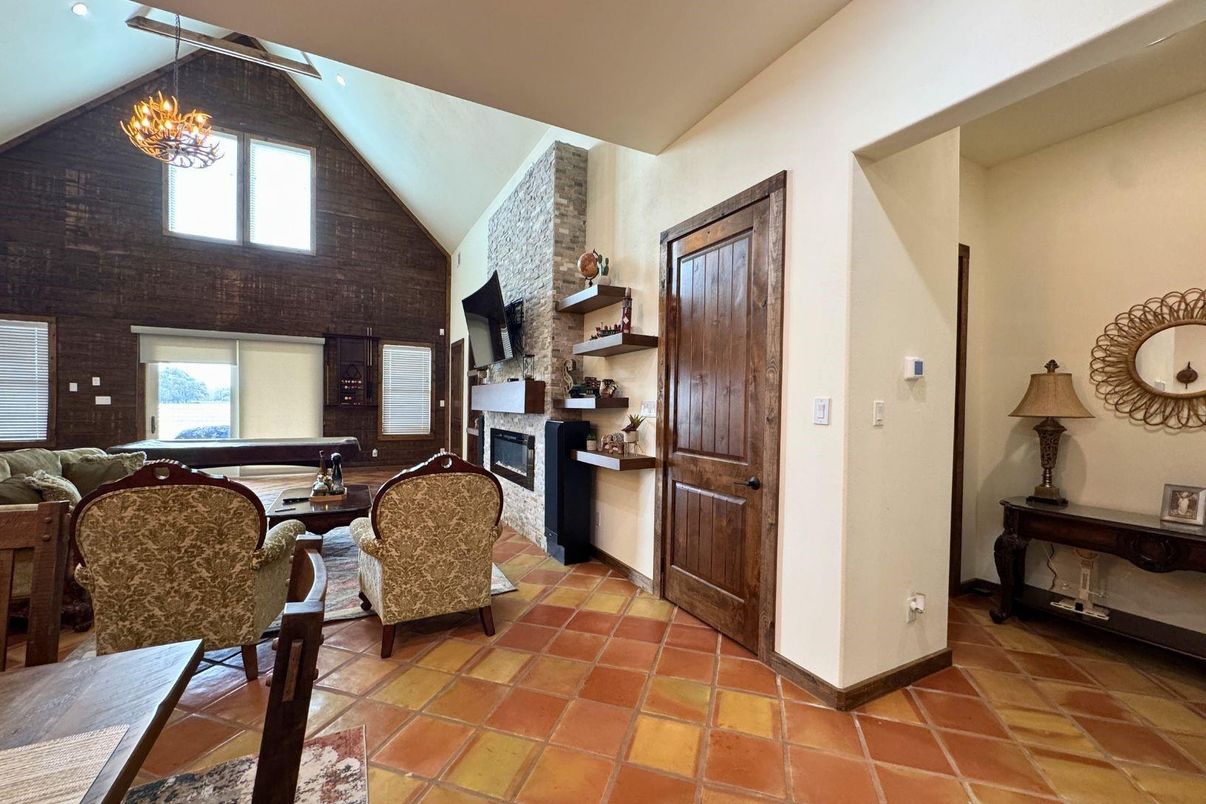 Chandelier, Dining room, Fireplace, Interior, Stone Walls