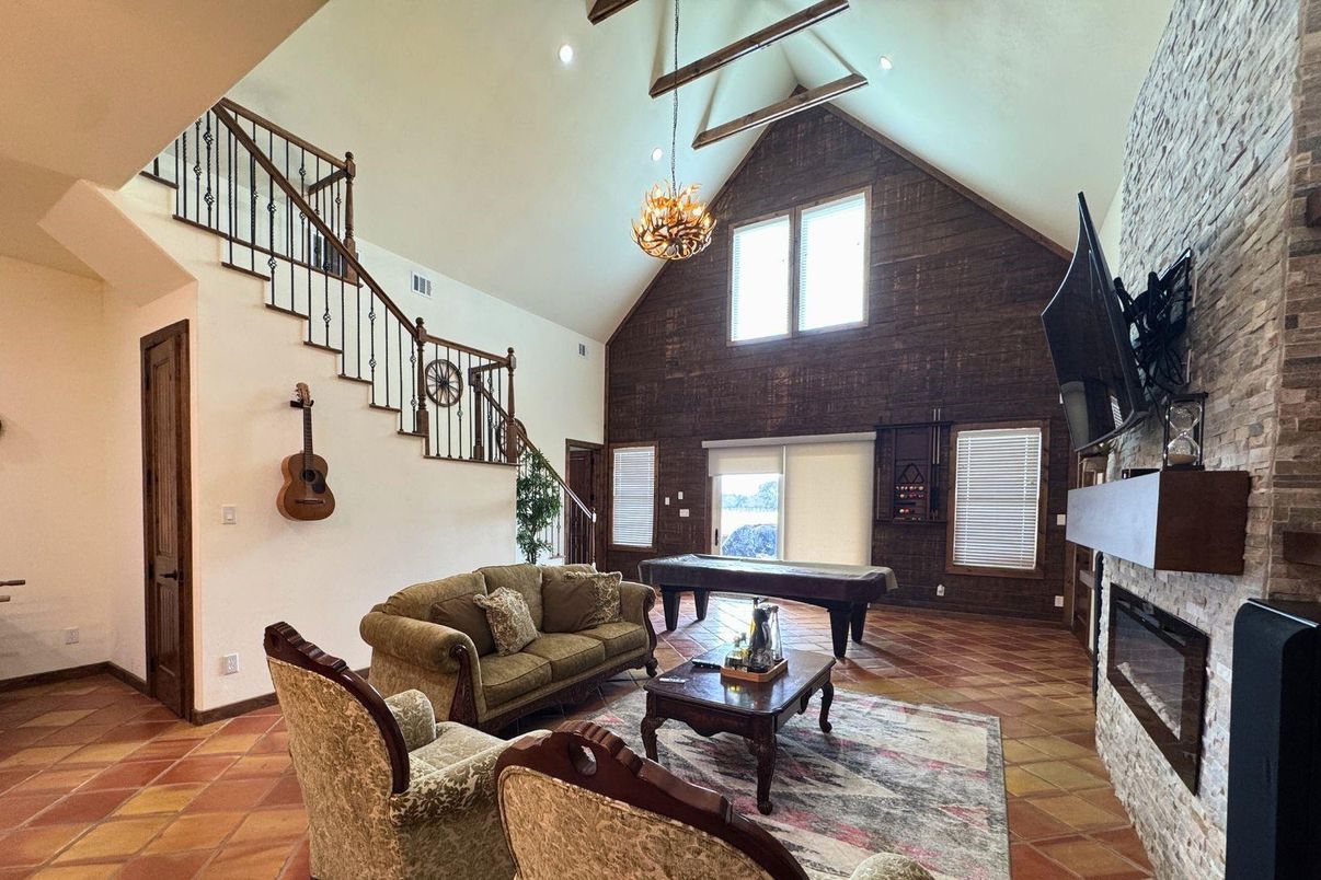 Billiard Table, Chandelier, Fireplace, Game Room, Interior, Living room, Recessed Lighting, Stone Walls