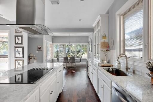 Chandelier, Dining room, Interior, Kitchen, Pendant Lights, Recessed Lighting, Stainless Steel Appliances, Wood Texture Flooring