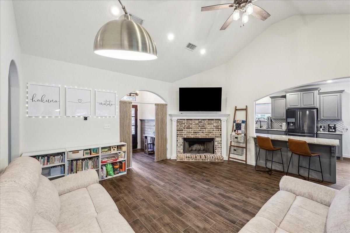 Fireplace, Interior, Kitchen, Living room, Recessed Lighting, Stainless Steel Appliances, Wood Texture Flooring