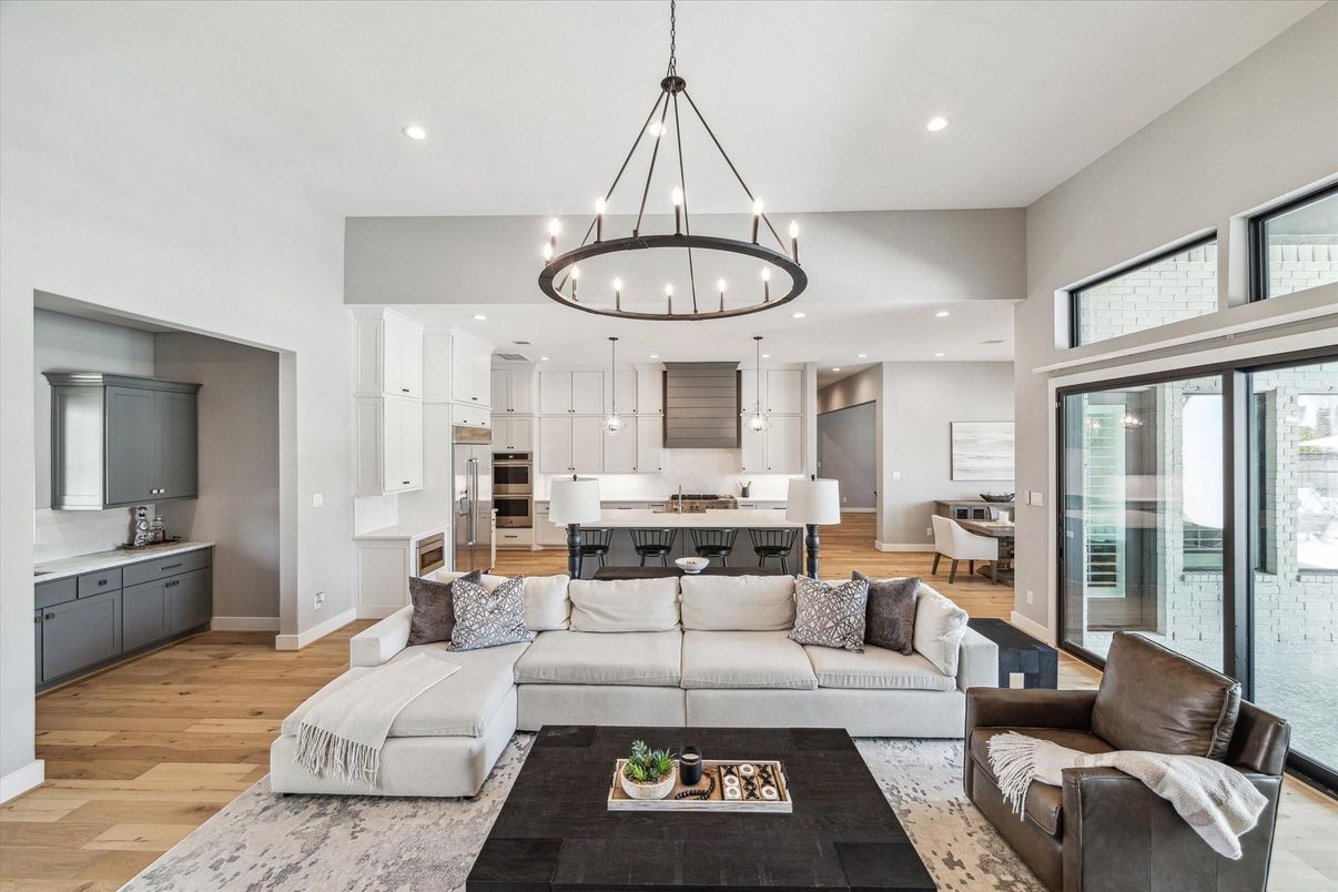 Chandelier, Dining room, Interior, Kitchen, Living room, Pendant Lights, Recessed Lighting, Stainless Steel Appliances, Wood Texture Flooring