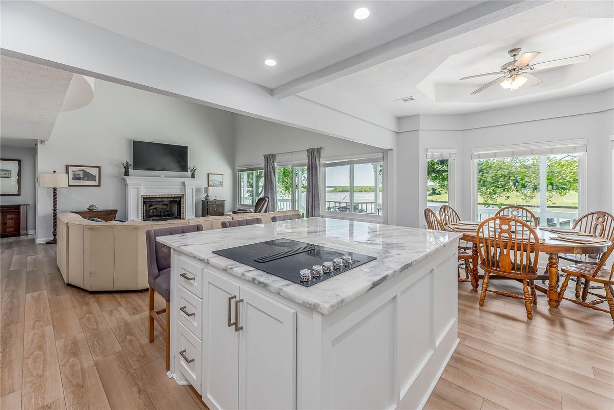 Dining room, Fireplace, Interior, Kitchen, Living room, Recessed Lighting, Wood Texture Flooring