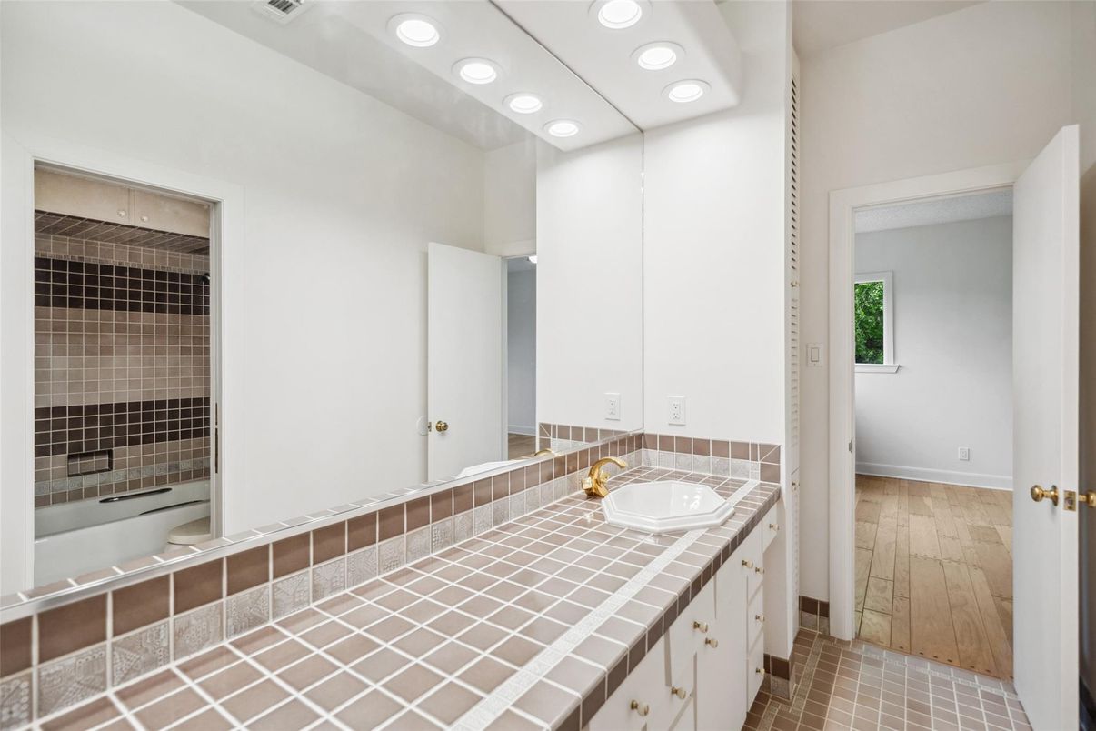 Bathroom, Dual Sink Vanities, Interior, Recessed Lighting, Tile Countertops, Wood Texture Flooring