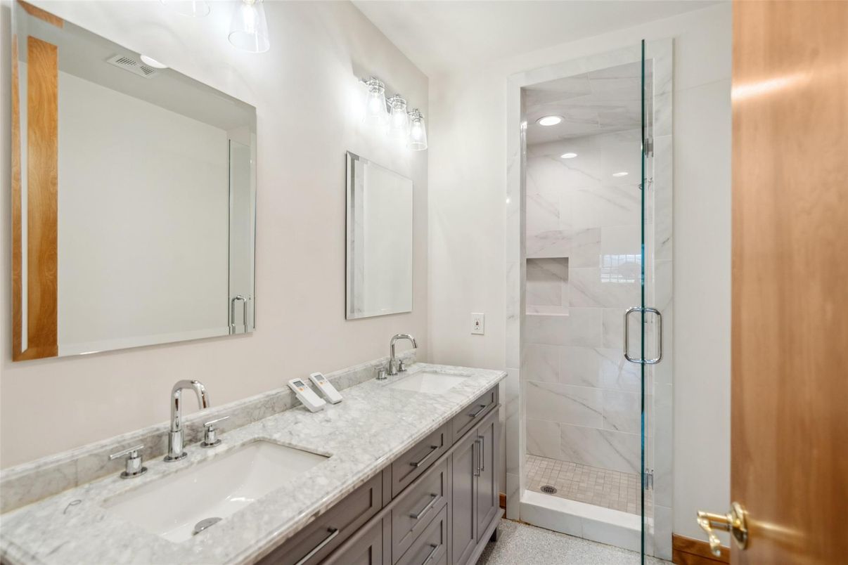 Bathroom, Dual Sink Vanities, Glass Shower, Interior, Marble Walls, Recessed Lighting