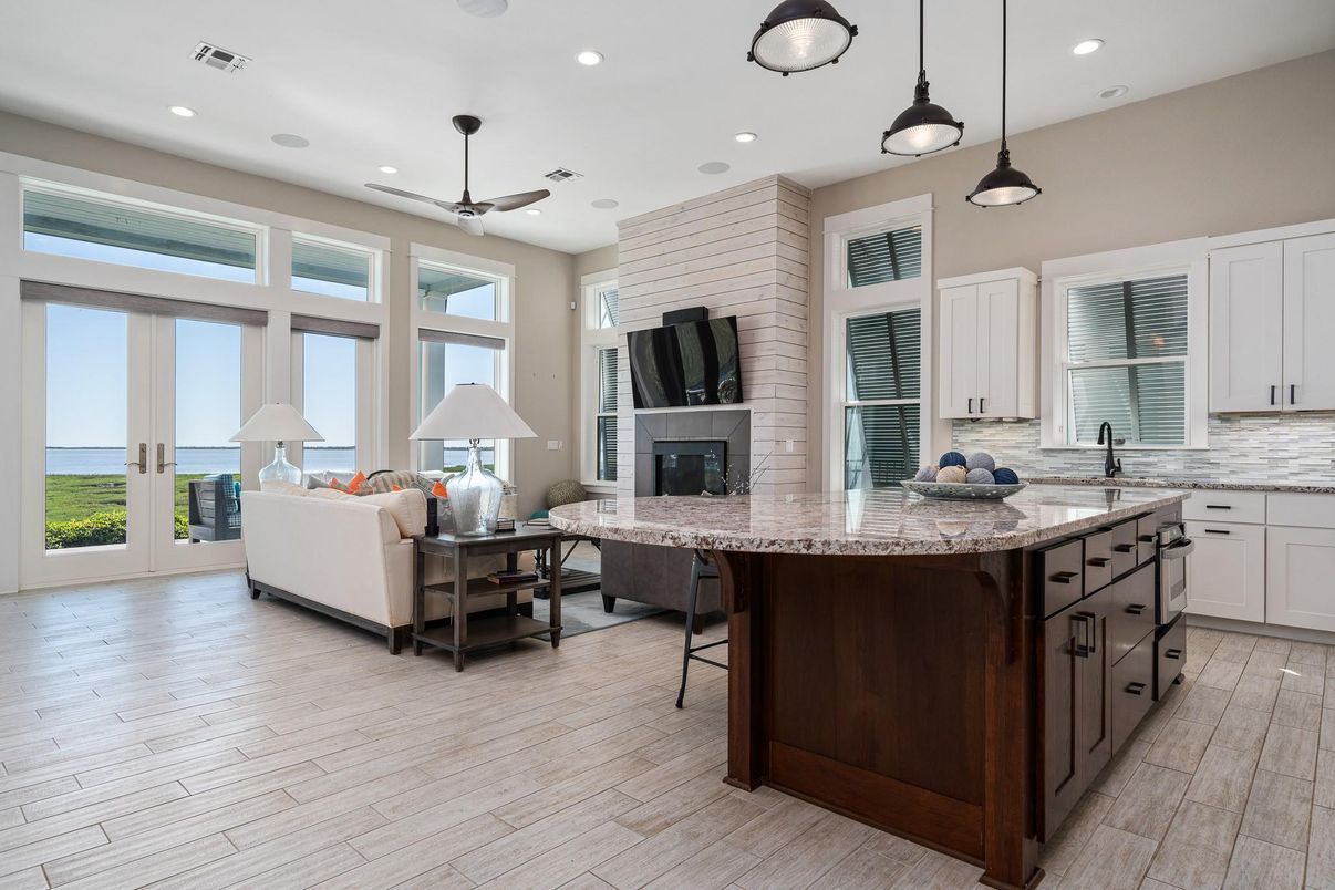 Fireplace, Interior, Kitchen, Living room, Pendant Lights, Recessed Lighting, Water, Wood Texture Flooring