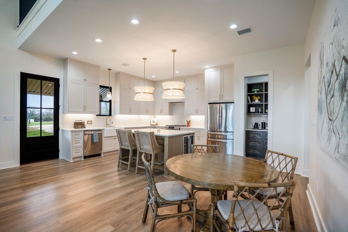 Dining room, Interior, Kitchen, Pendant Lights, Recessed Lighting, Stainless Steel Appliances, Wood Texture Flooring
