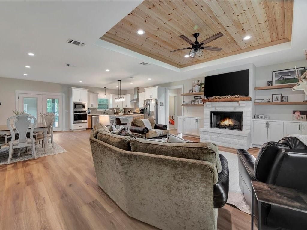 Dining room, Fireplace, Interior, Kitchen, Living room, Pendant Lights, Recessed Lighting, Stainless Steel Appliances, Wooden Ceilings, Wood Texture Flooring