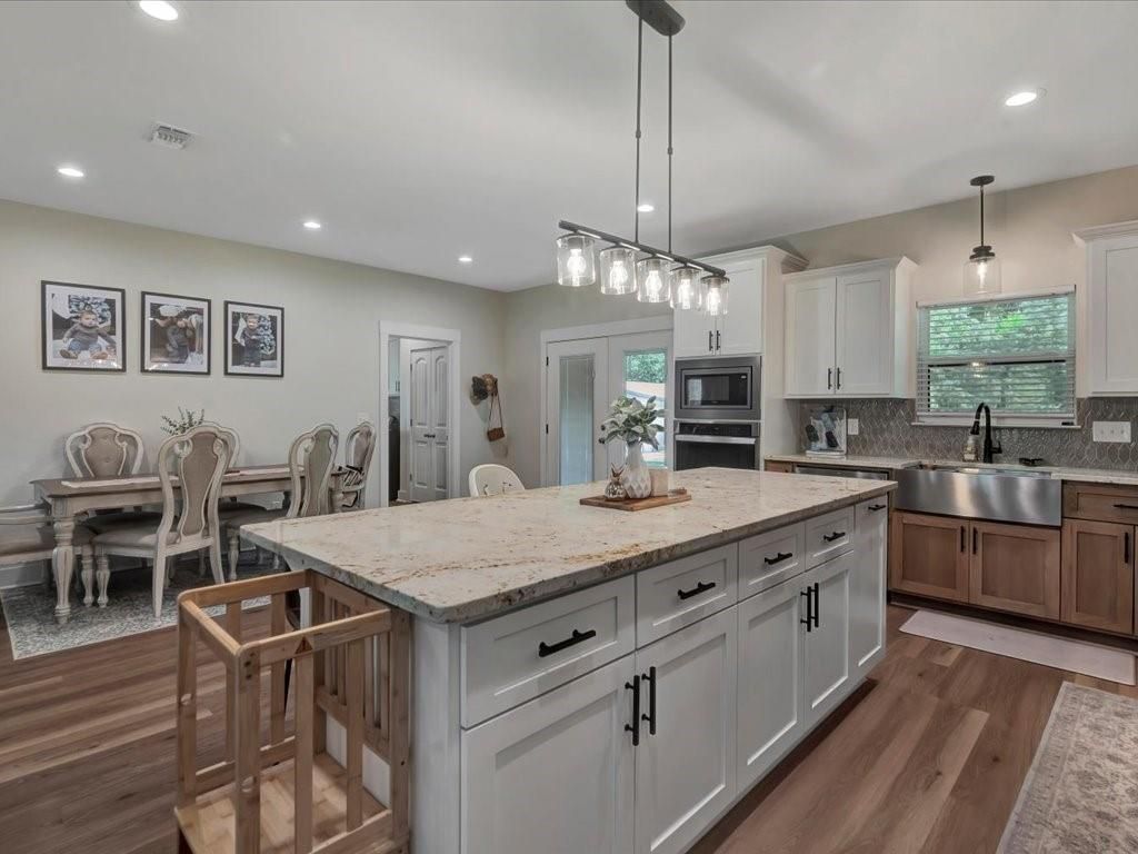 Dining room, Interior, Kitchen, Pendant Lights, Recessed Lighting, Stainless Steel Appliances, Wood Texture Flooring