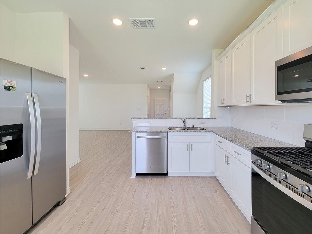 Interior, Kitchen, Recessed Lighting, Stainless Steel Appliances, Wood Texture Flooring