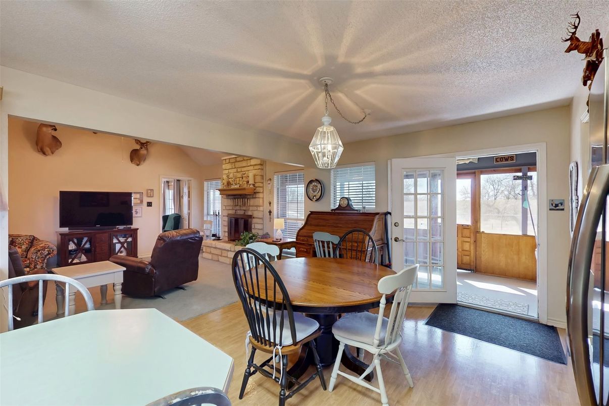 Dining room, Fireplace, Interior, Living room, Pendant Lights, Stone Walls, Wood Texture Flooring