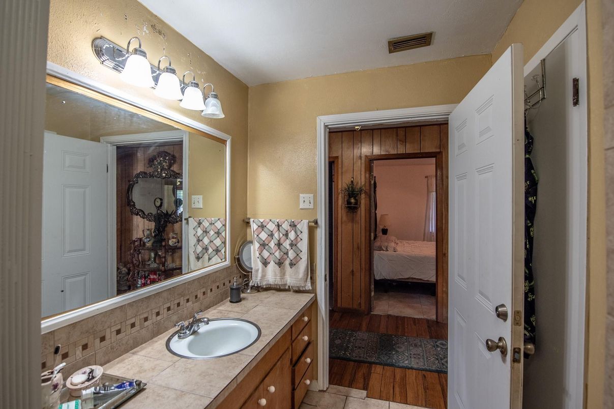 Bathroom, Bedroom, Dual Sink Vanities, Interior, Tile Countertops, Wood Texture Flooring