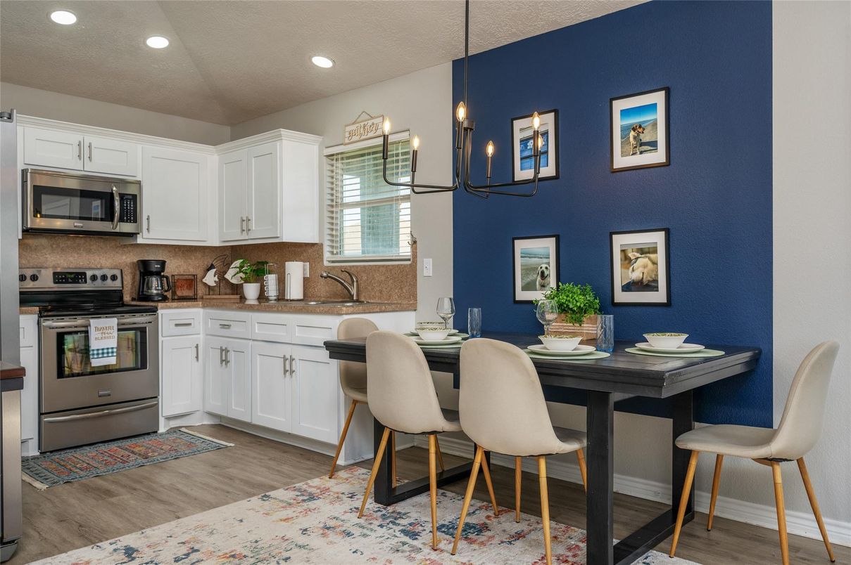 Chandelier, Dining room, Interior, Kitchen, Pendant Lights, Recessed Lighting, Stainless Steel Appliances, Wood Texture Flooring