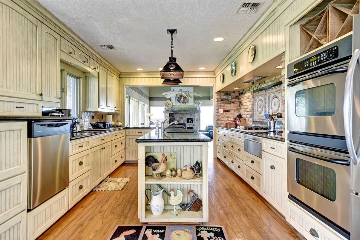 Interior, Kitchen, Pendant Lights, Recessed Lighting, Stainless Steel Appliances, Stone Walls, Wood Texture Flooring