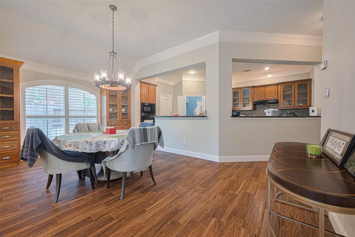 Chandelier, Dining room, Interior, Kitchen, Pendant Lights, Recessed Lighting, Stainless Steel Appliances, Wood Texture Flooring