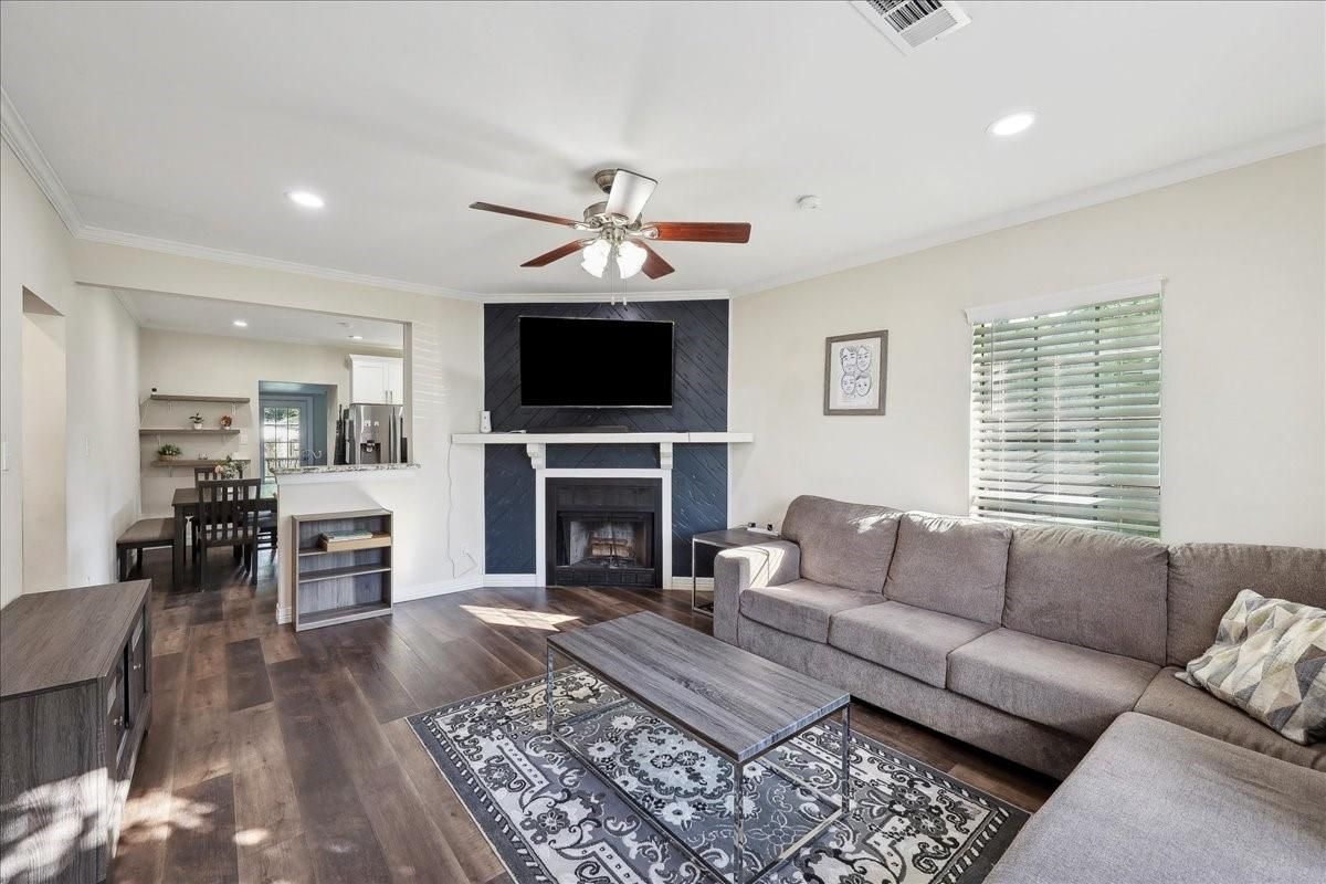 Dining room, Fireplace, Interior, Living room, Recessed Lighting, Wood Texture Flooring