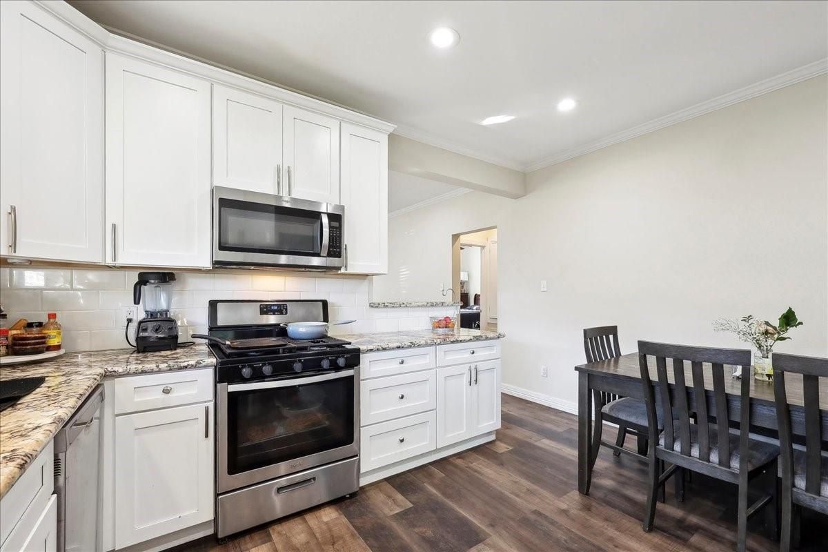 Dining room, Interior, Kitchen, Recessed Lighting, Stainless Steel Appliances, Wood Texture Flooring