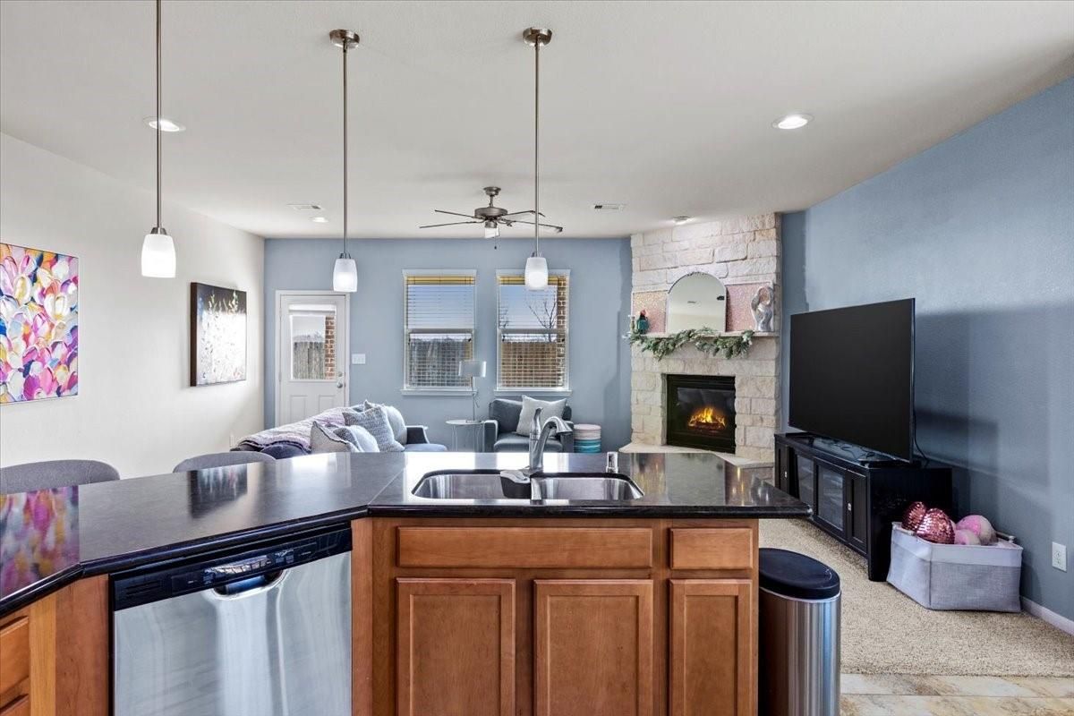 Dining room, Fireplace, Interior, Kitchen, Pendant Lights, Recessed Lighting, Stainless Steel Appliances, Stone Walls