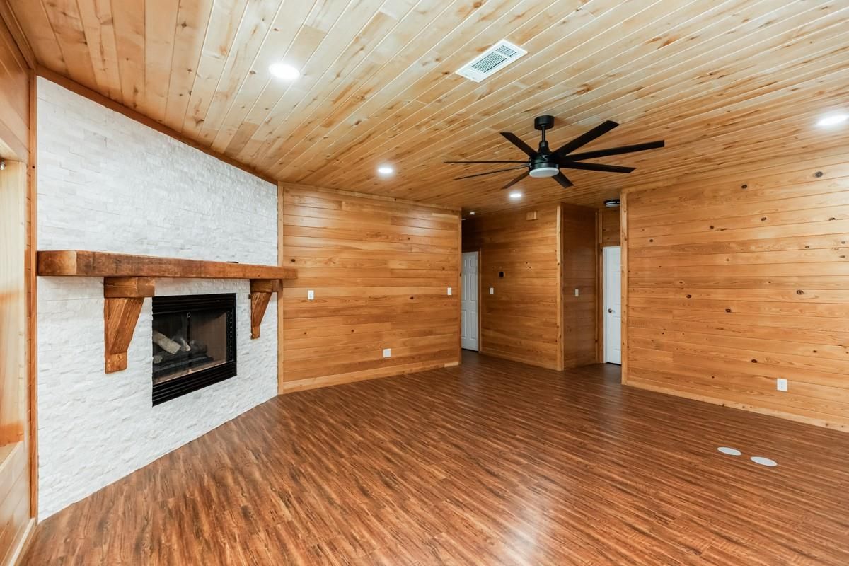 Empty room, Fireplace, Interior, Recessed Lighting, Wooden Ceilings, Wood Texture Flooring, Wooden Walls
