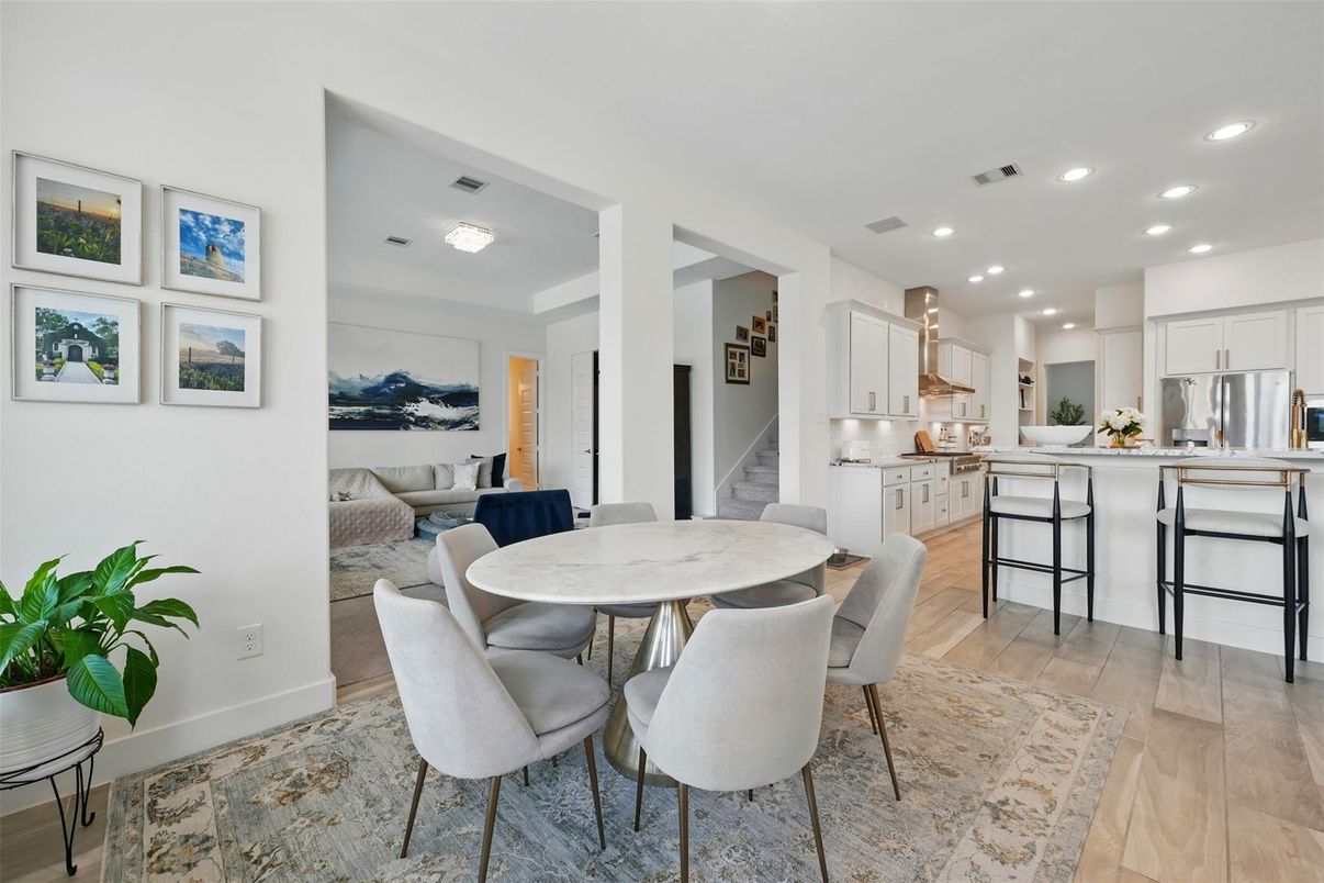 Dining room, Interior, Kitchen, Living room, Recessed Lighting, Stainless Steel Appliances, Wood Texture Flooring