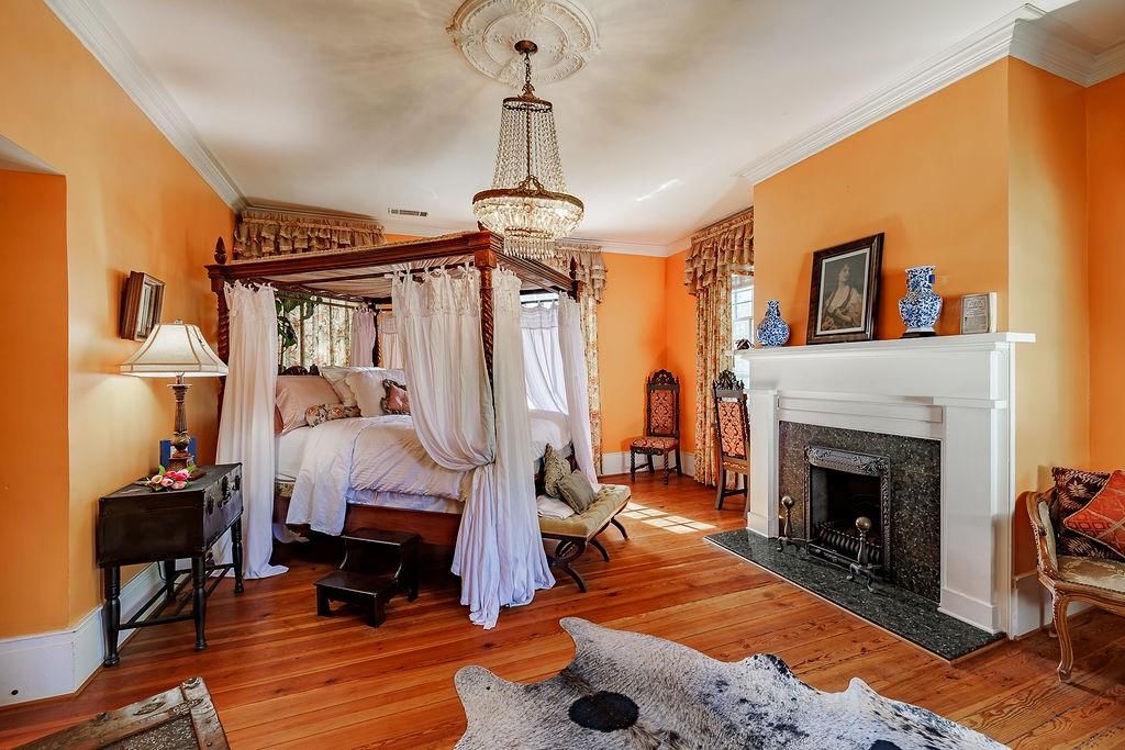 Bedroom, Chandelier, Fireplace, Interior, Wood Texture Flooring