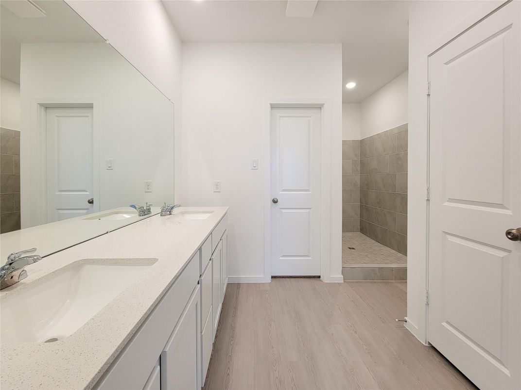Bathroom, Dual Sink Vanities, Interior, Recessed Lighting, Wood Texture Flooring