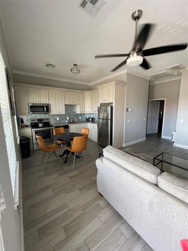 Dining room, Interior, Kitchen, Living room, Stainless Steel Appliances, Wood Texture Flooring