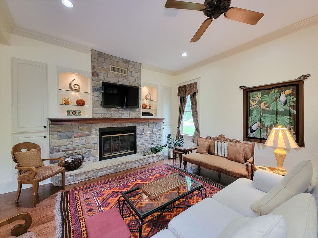 Fireplace, Interior, Living room, Recessed Lighting, Stone Walls, Wood Texture Flooring