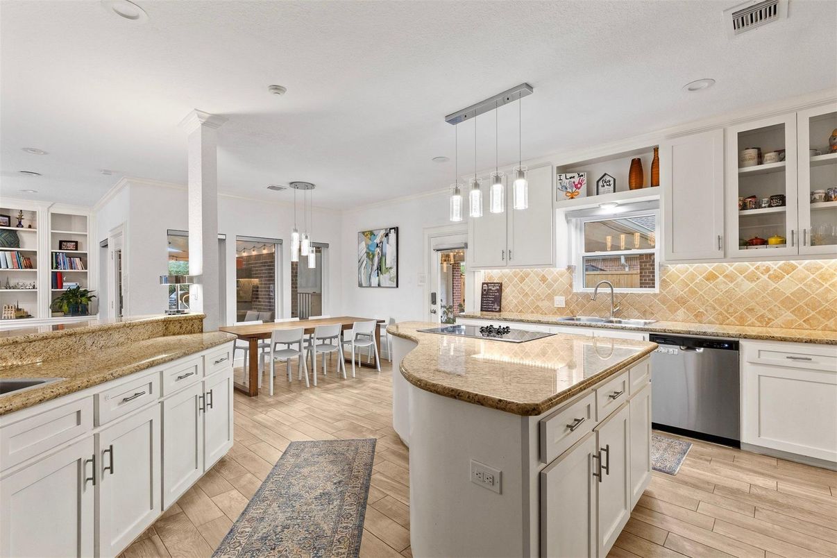 Dining room, Interior, Kitchen, Pendant Lights, Recessed Lighting, Stainless Steel Appliances, Wood Texture Flooring