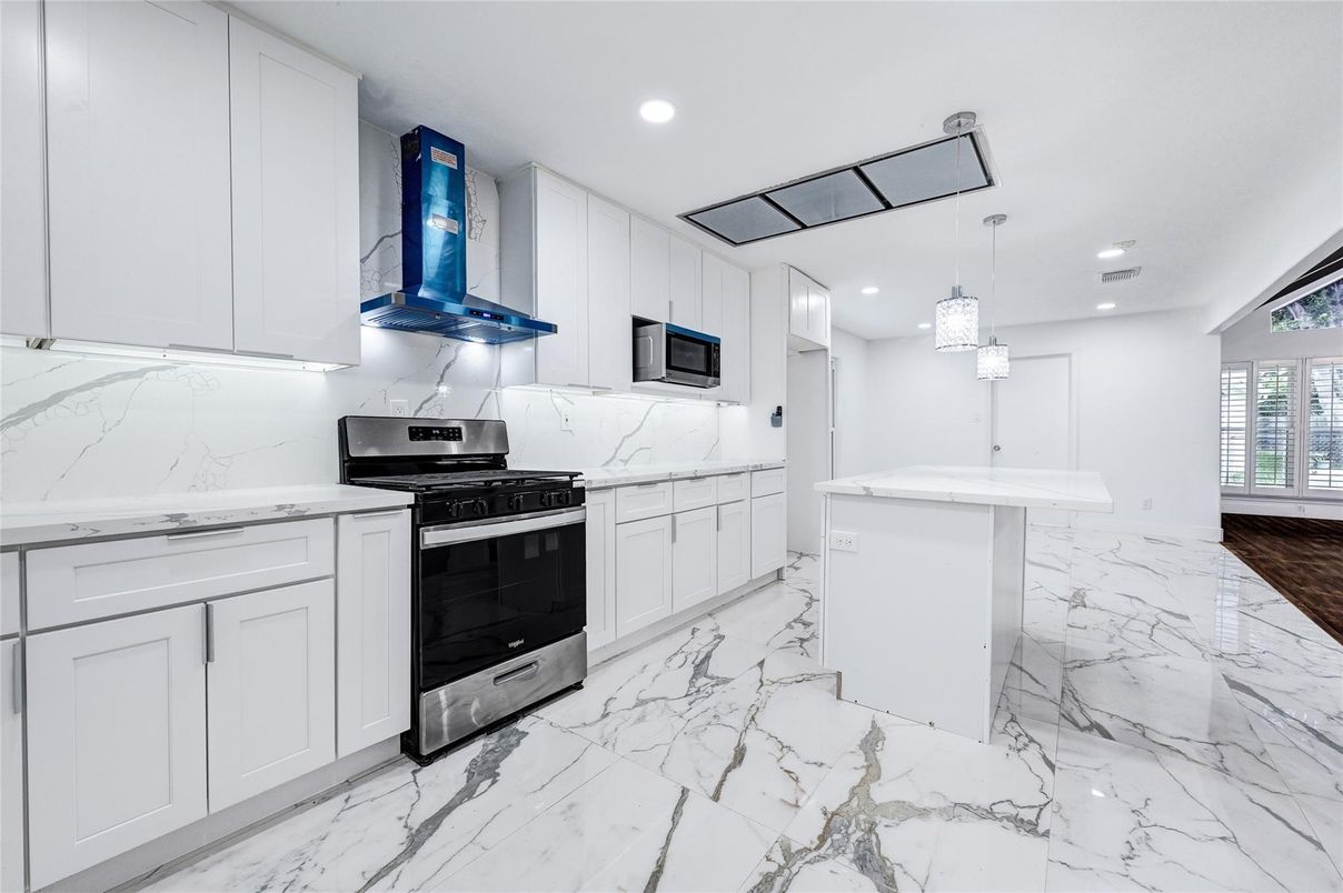 Interior, Kitchen, Marble, Marble Walls, Pendant Lights, Recessed Lighting, Stainless Steel Appliances