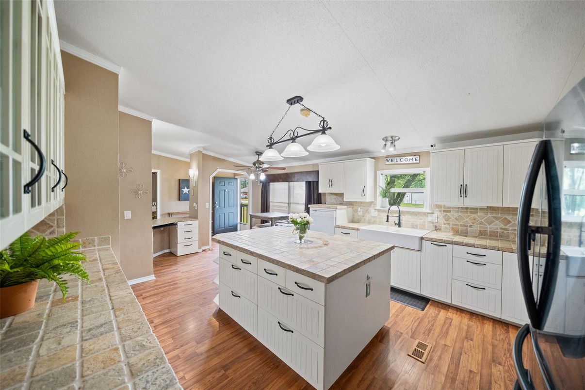 Interior, Kitchen, Pendant Lights, Tile Countertops, Wood Texture Flooring