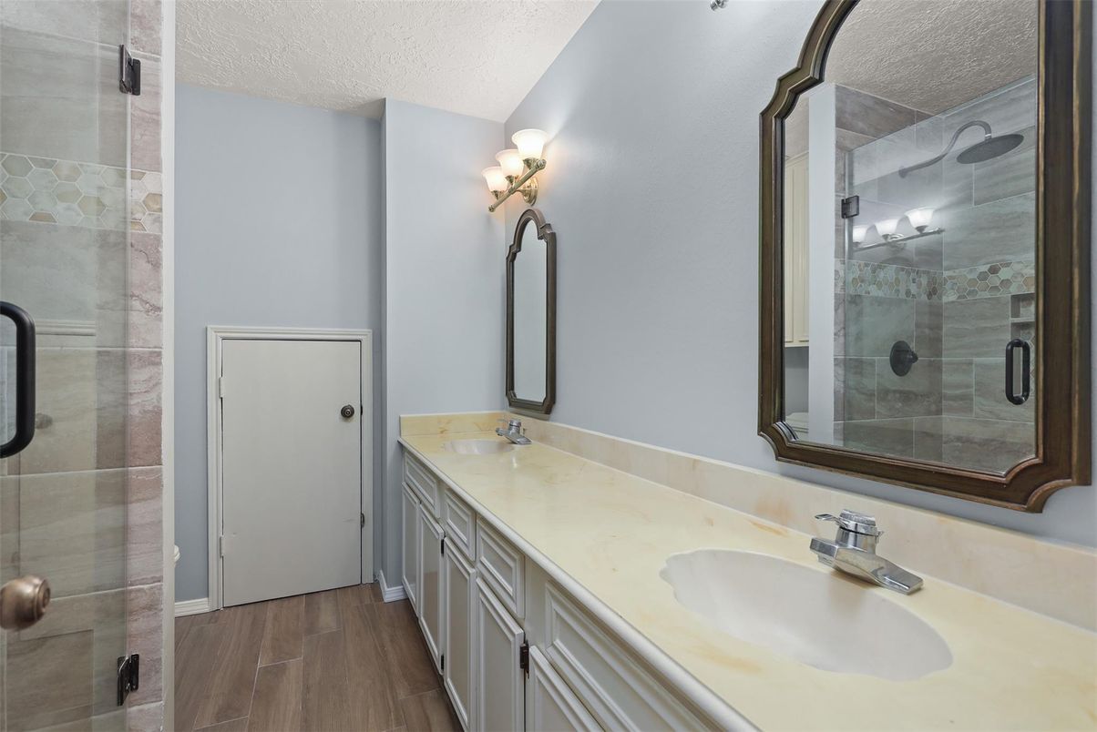Bathroom, Dual Sink Vanities, Glass Shower, Interior, Wood Texture Flooring