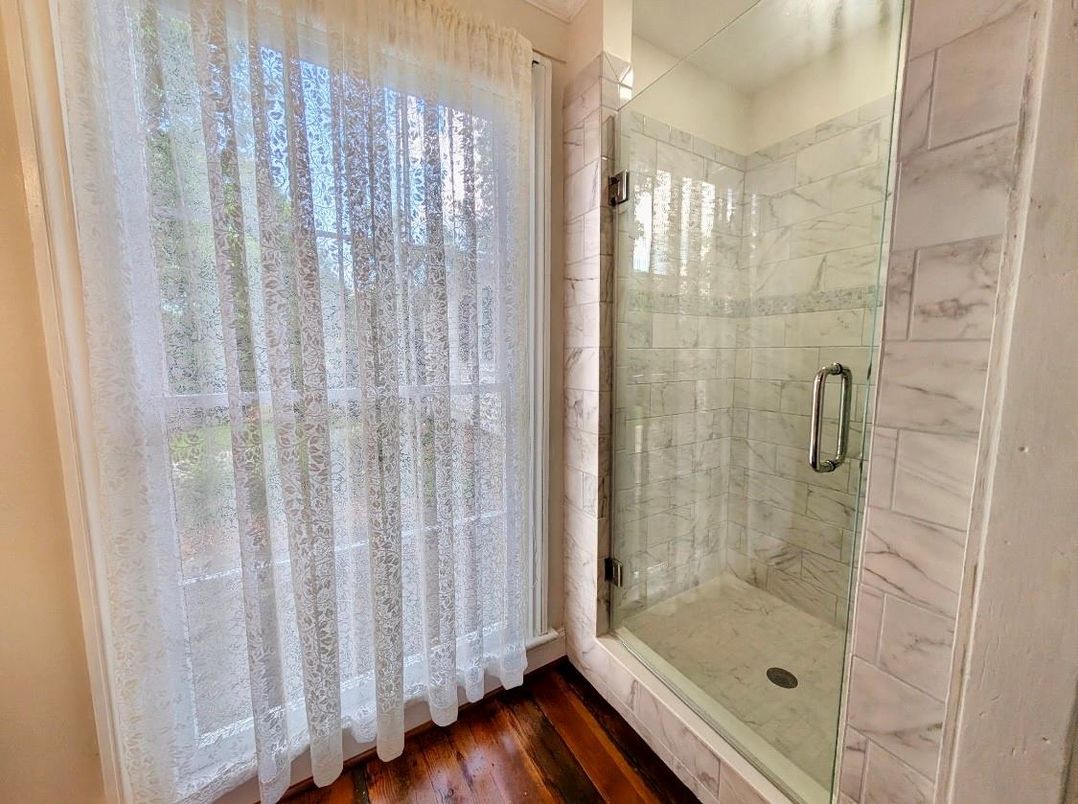 Bathroom, Glass Shower, Interior, Marble Walls, Wood Texture Flooring