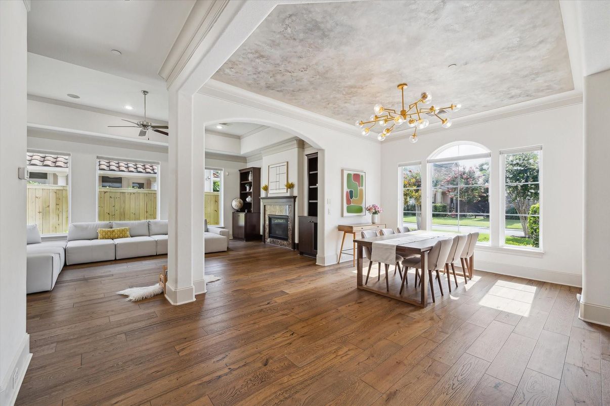 Dining room, Fireplace, Interior, Living room, Pendant Lights, Recessed Lighting, Wood Texture Flooring