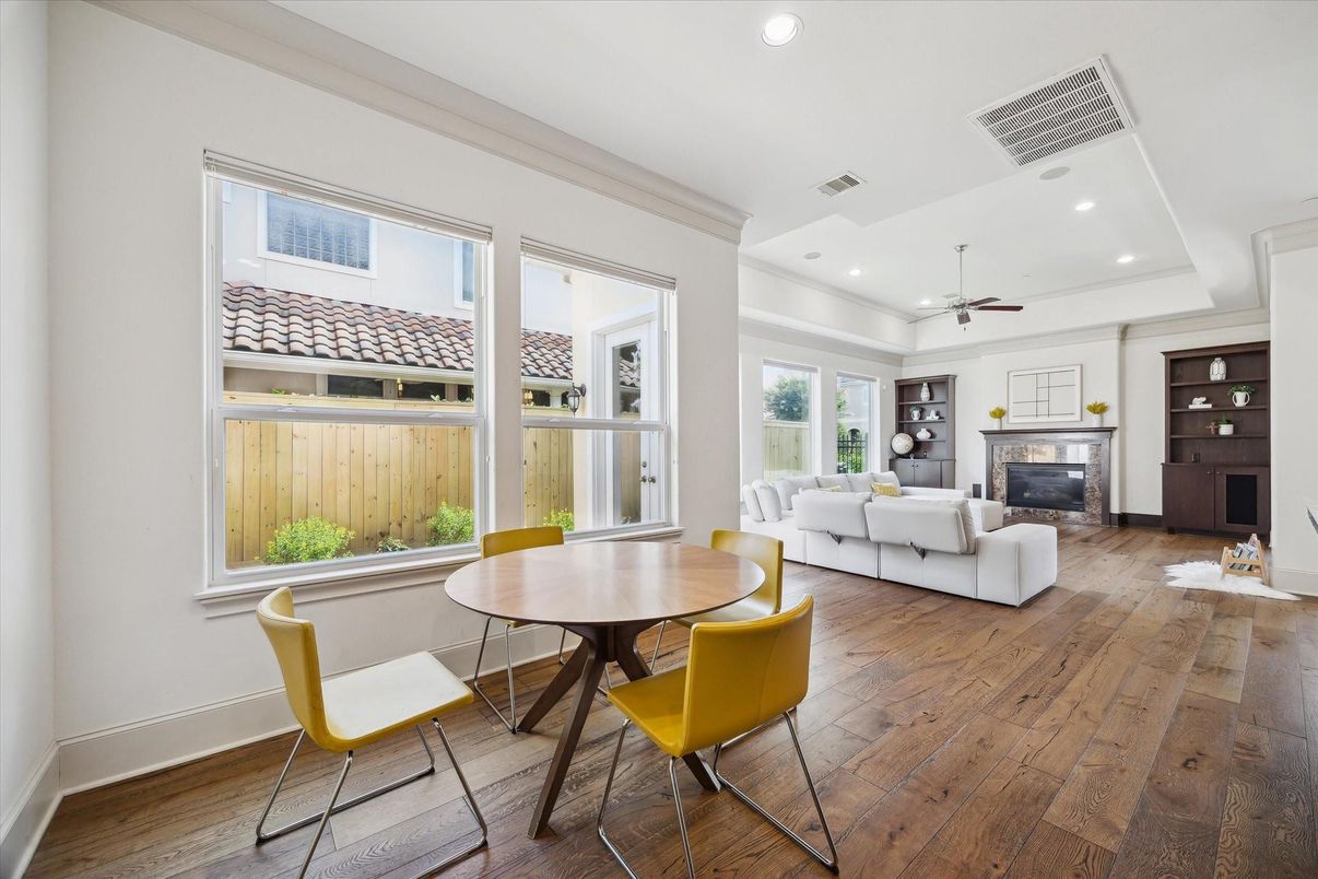 Dining room, Fireplace, Interior, Living room, Recessed Lighting, Wood Texture Flooring
