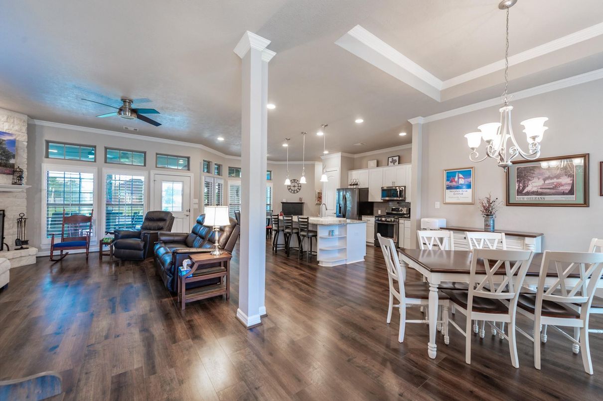 Chandelier, Dining room, Fireplace, Interior, Kitchen, Living room, Pendant Lights, Recessed Lighting, Stainless Steel Appliances, Wood Texture Flooring