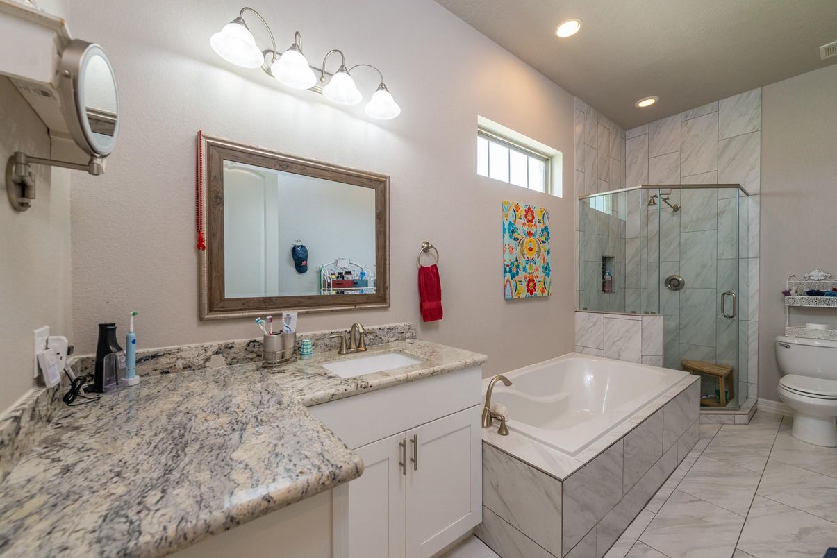 Bathroom, Dual Sink Vanities, Glass Shower, Interior, Marble, Marble Walls, Recessed Lighting