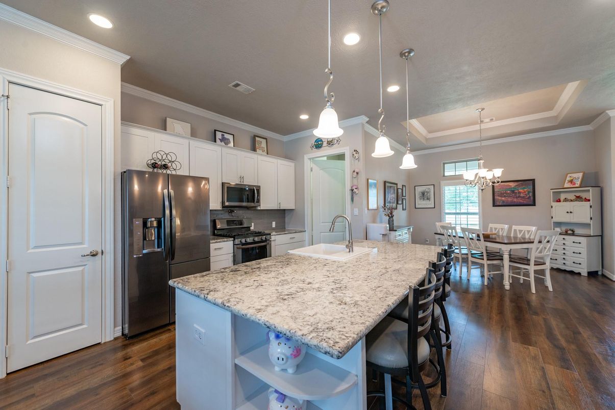 Chandelier, Dining room, Interior, Kitchen, Pendant Lights, Recessed Lighting, Stainless Steel Appliances, Wood Texture Flooring