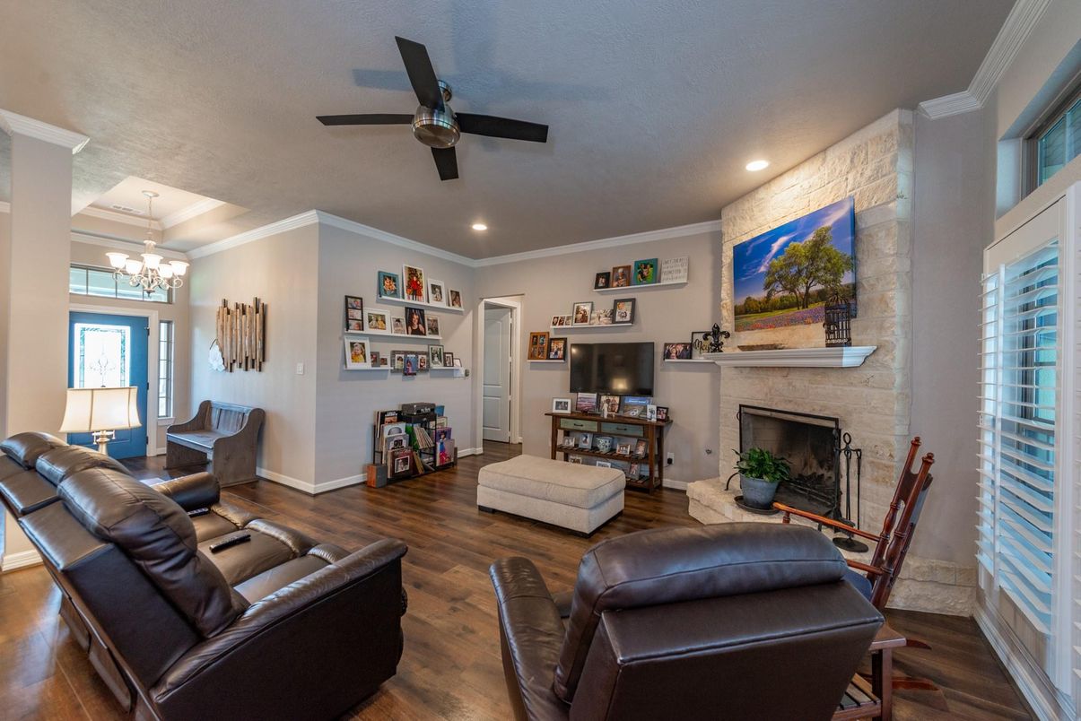 Chandelier, Dining room, Fireplace, Interior, Living room, Recessed Lighting, Stone Walls, Wood Texture Flooring